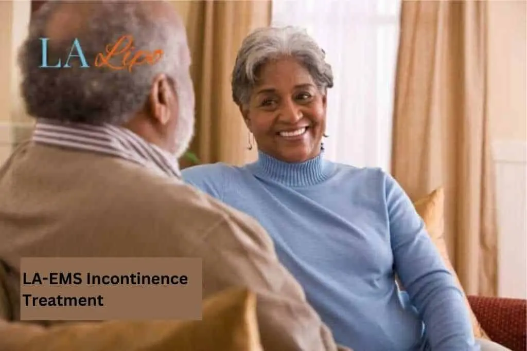 Couple sat smiling at each other - LA-EMS treatment Gateshead